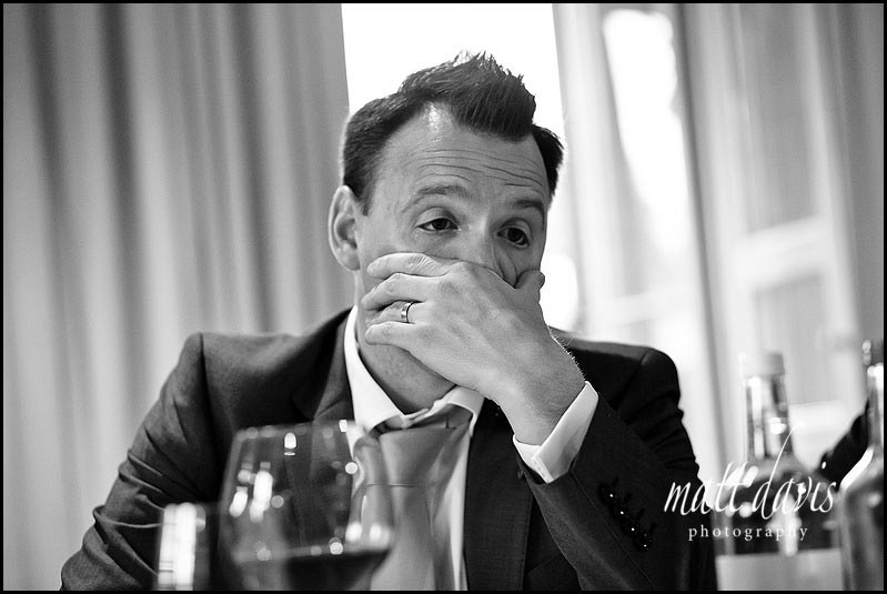 Barnsley House wedding photography of groom pulling a funny face