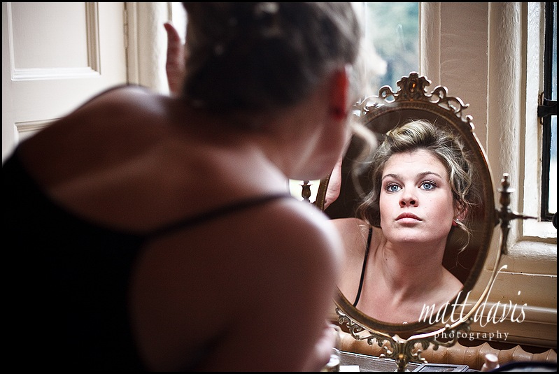 Wedding make-up in mirror at Clearwell Castle