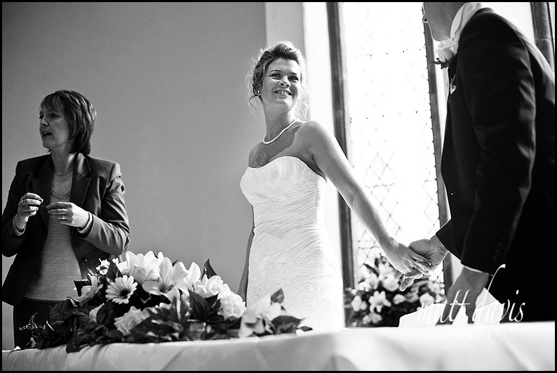 Bride smiling at groom at Clearwell Castle
