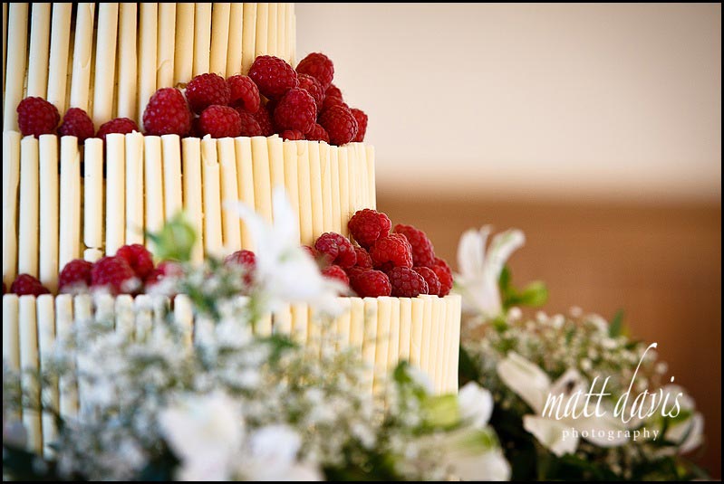 White chocolate wedding cake with raspberries
