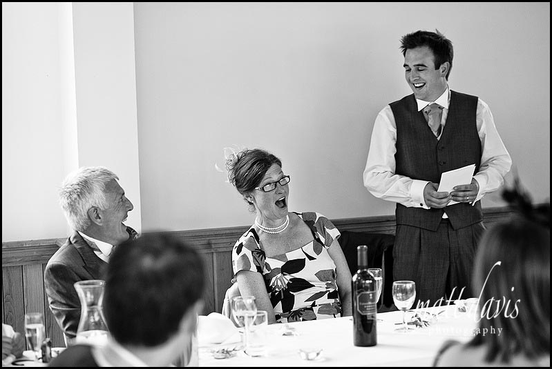 Shocked mother of the bride during wedding speeches at Delbury Hall 