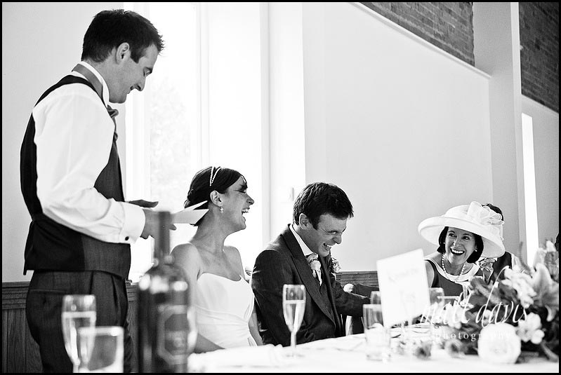 Laughing mother of the groom during wedding speeches at Delbury Hall 