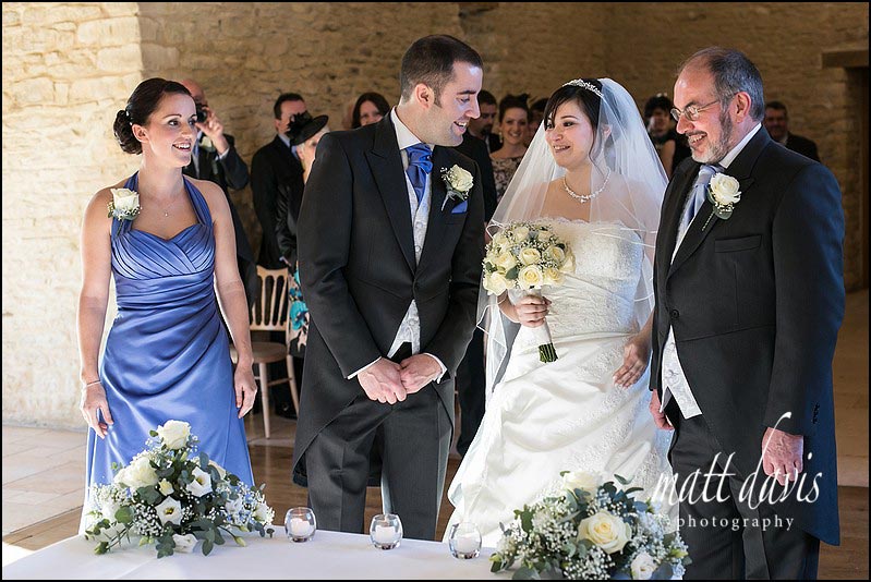 Bride meeting groom for first time at a civil wedding ceremony in Kingscote Barn Gloucestershire