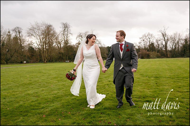 Natural wedding photos of couple on lawn at Elmore Court